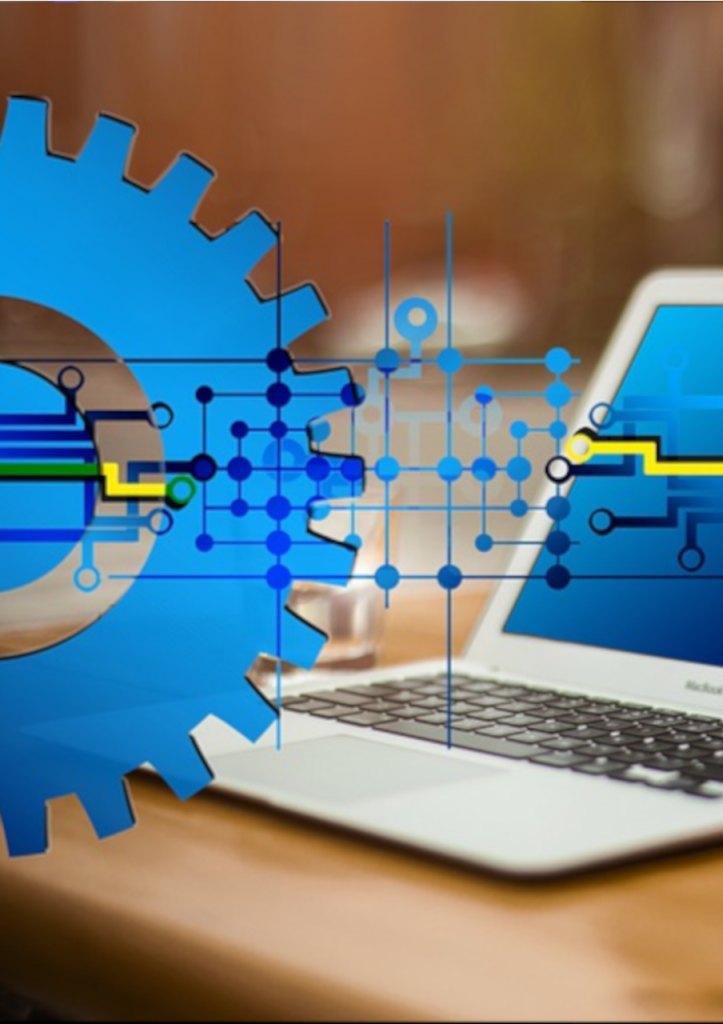Laptop with gears representing IT system upgrade for scalability, security, and business efficiency