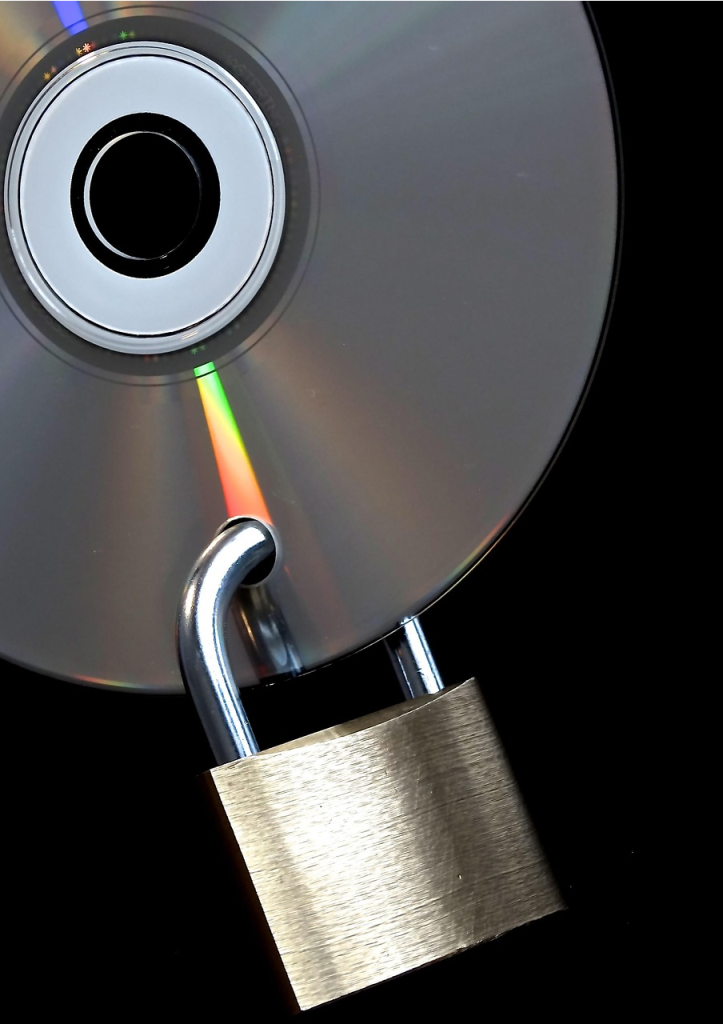 Encrypted backup symbolized by a CD with a padlock ensuring data security for SMEs